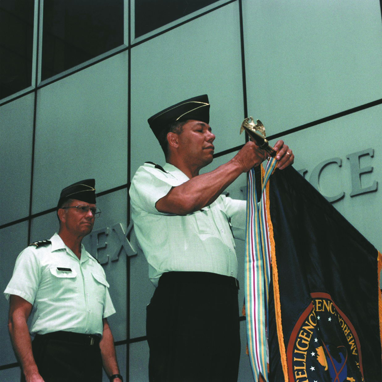 Image of General Colin Powell presenting the Meritorious Unit Award.